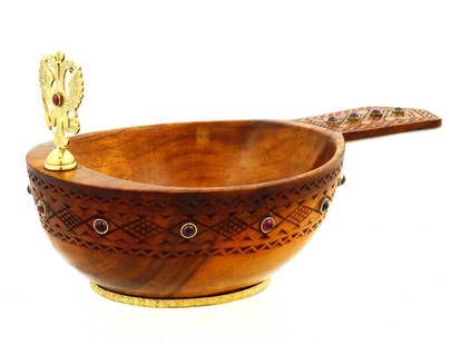 RUSSIAN CARVED WOODEN SILVER AND GEMSTONES KOVSH: A Russian hand carved wooden kovsh with silver and gemstone embellishments. The exterior of the bowl features carved geometric patterns and is set with gemstones. The handle of the bowl is decorated w
