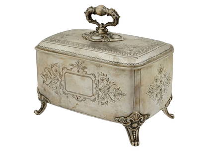 RUSSIAN ENGRAVED 84 SILVER SUGAR BOX: A Russian silver sugar box. The box is rectangular with a slightly rounded top. It sits on four ornate, curved feet. The surface of the box is decorated with engraved floral and foliate designs, and t