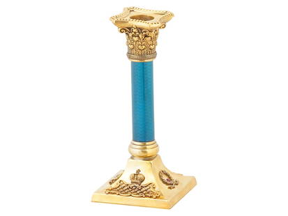 RUSSIAN SILVER GUILLOCHE ENAMEL CANDLESTICK W DIAMONDS: A Russian gilt silver candlestick, enriched with a vibrant blue enamel column featuring guilloche enamel intricacies. Decorated with a Corinthian order. The base is set with diamonds and gemstones. Fl