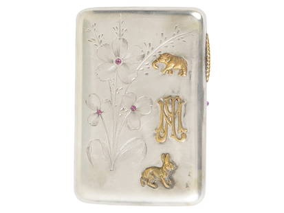RUSSIAN SILVER ENGRAVED CIGARETTE CASE W GEMSTONES: A Russian 84 Silver cigarette case. The exterior of the case is adorned with raised designs representing an elephant, a rabbit, and Royal monograms. The exterior of the ware features an engraved flora