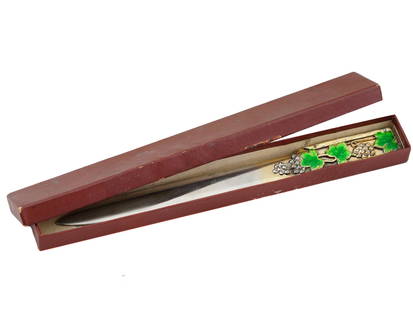 RUSSIAN SILVER ENAMEL LETTER OPENER WITH DIAMONDS IOB: A Russian silver letter opener adorned with enamel and diamonds. The handle is decorated on both sides with a design of enameled green leaves and clusters of silver grapes, which are encrusted with di