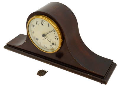 AMERICAN SESSIONS WOODEN MANTEL CLOCK: An American mantel clock by the Sessions Clock Company. Early 20th Century. Key wind mechanism. Hardwood case. White round dial behind convex glass door, Arabic numerals. Bears a paper label inside. T