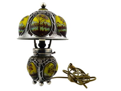 MOHR LF CAMEO GLASS AND STERLING SILVER TABLE LAMP: A vintage sterling silver and cameo glass table lamp with modern electrical fittings. Art Nouveau style. Bulbous base resting on ball feet, matching lampshade design. Engraved tree motifs. Convex glas