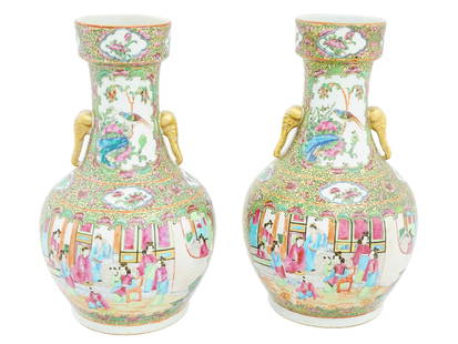 PAIR OF ANTIQUE CHINESE FAMILLE ROSE PORCELAIN VASES: A pair of antique 19th century Chinese Famille Rose porcelain vases. The vases share a similar shape, featuring a round body that tapers into a slender neck, with a flared rim at the top. They are ado