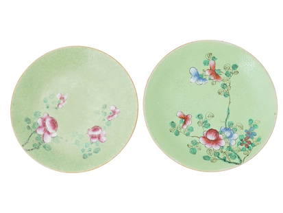 ANTIQUE CHINESE QING FAMILLE ROSE PORCELAIN PLATES: A pair of antique Chinese Qing Dynasty hand painted green ground Famille Rose porcelain plates decorated with flower motifs. Circa the early 20th century, before 1912. Marked with red ink on the botto