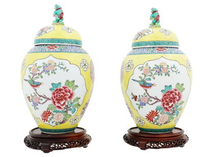 ANTIQUE FRENCH CHINOISERIE PORCELAIN LIDDED VASES: A pair of antique 19th-century French Chinoiserie hand-painted porcelain lidded vases. Famille jaune design. Sculpted dog finials on the lids. Marked France on the bottom of each piece. Both vases com