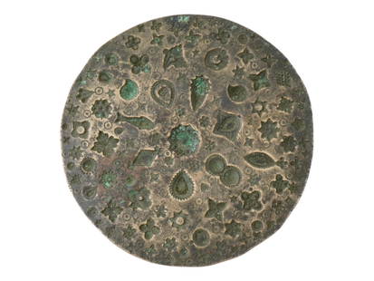 ANCIENT ROMAN BRONZE STAMP DYE JEWELRY TOOL MOLD: An ancient Roman engraved bronze stamp dye jewelry tool mold. The round shaped ware is adorned with engraved patterns. Circa: 200 AD. Ancient and Antique Brass Wares, Tools, Museum Pieces, and Histori