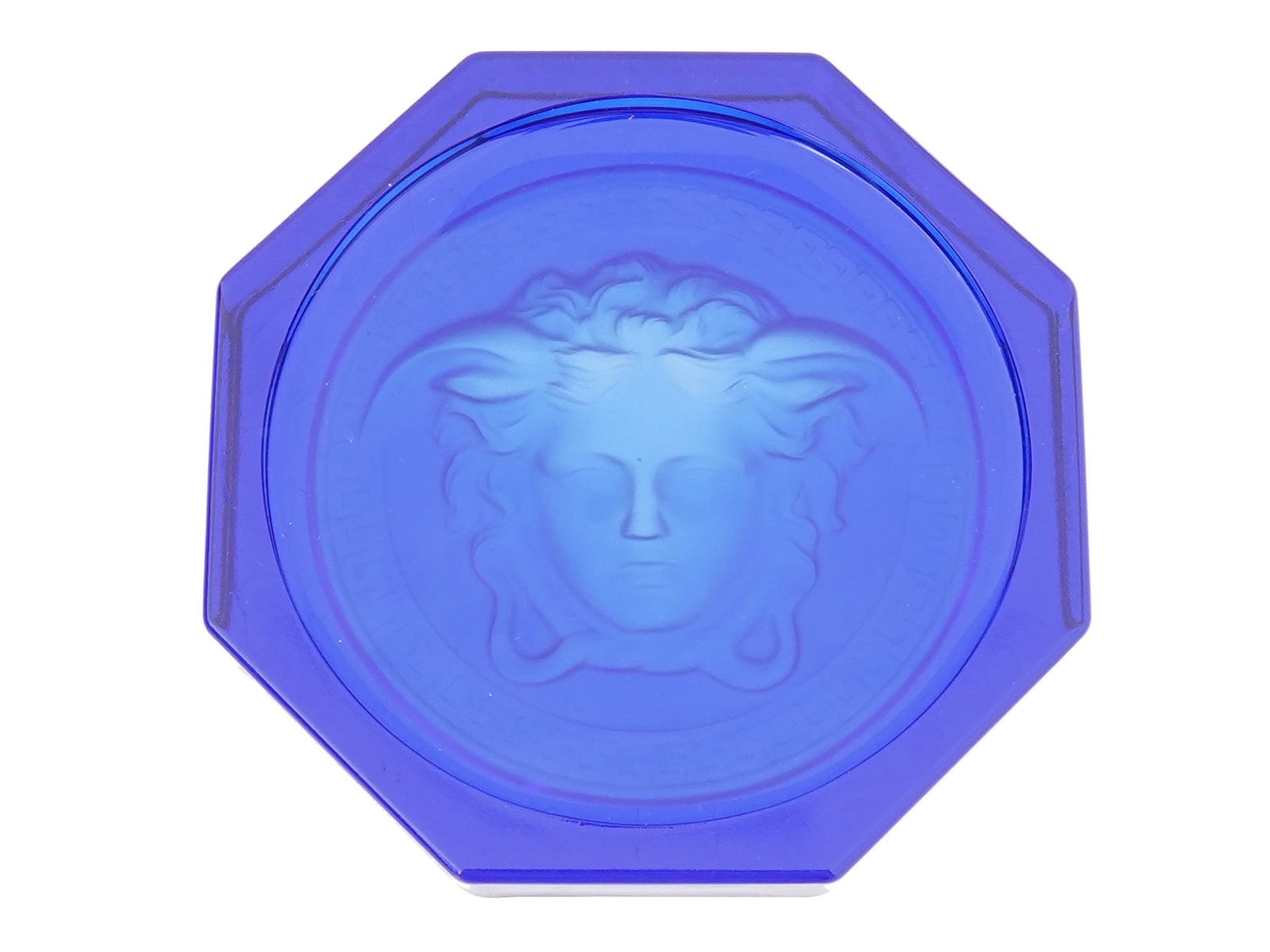 VERSACE ROSENTHAL MEDUSA COBALT GLASS COASTER ASHTRAY: A Versace Rosenthal Medusa green cobalt blue coaster or ashtray. Circa: 2000s. The ware features the iconic Medusa pattern in cobalt blue green. The coaster is made of high quality uranium, vaseline g
