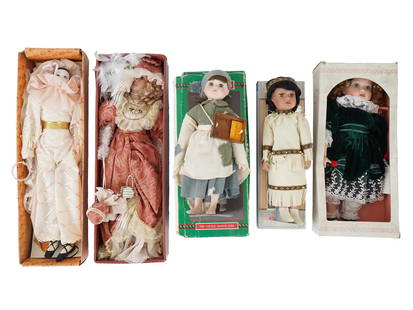 COLLECTION OF VINTAGE PORCELAIN DOLLS: This Collection of Vintage Porcelain Dolls offers a charming assortment of beautifully crafted pieces, perfect for collectors or those who appreciate fine doll artistry. The lot includes a Chatelaine