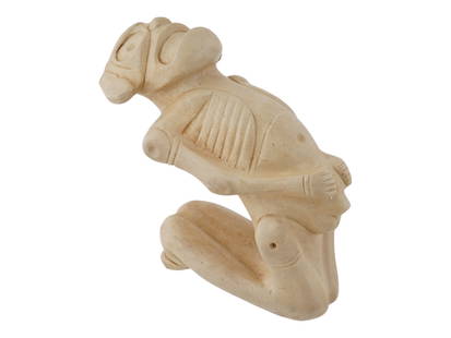 ANCIENT PRE COLUMBIAN TAINO JASPER CACIQUE FIGURINE: An ancient Pre-Columbian Taino carved jasper figurine depicting a cacique chief bending backwards, with hands resting just above the phallus. This expressive figure reflects the distinctive artistry a