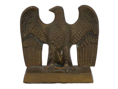 VINTAGE BRONZE EAGLE DESK FIGURINE OR PAPERWEIGHT: A fine vintage bronze desk figurine or paperweight with a stand. The well detailed bronze eagle is depicted facing to the left with its massive wings spread wide. It is raised on a rectangular base. P