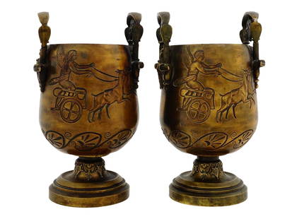 ANTIQUE EGYPTIAN REVIVAL GRAND TOUR BRONZE VASES: A pair of antique Egyptian Revival patinated bronze vases of the Grand Tour. Circa the late 19th century. 1880s. The fine vases, raised on a round base, feature an elongated body with vertical openwor