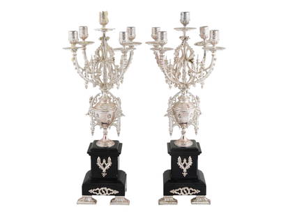 PAIR ANTIQUE FRENCH GOTHIC MANNER COIN SILVER CANDELABRAS: A pair of antique French Gothic manner low-grade Coin Silver candelabras. Each candelabrum features an intricate design, showcasing ornate detailing. Each candelabrum has multiple arms with five bowls