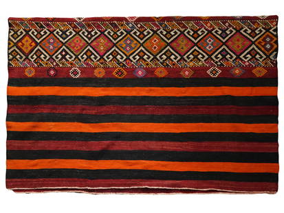 VINTAGE TURKISH KILIM AREA OUSHAK HANDMADE RUG TEXTILE: A vintage Turkish Kilim area Oushak handmade rug. The rug is characterized by a striped pattern in the main field, with alternating colors of black, red, and orange. At the top, there is a decorative
