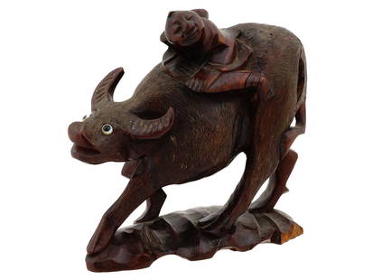 VTG CHINESE CARVED WOODEN SCULPTURE MAN RIDING A BULL: A vintage Chinese hand carved wooden sculpture of a man riding a bull. The carving is detailed and has a dark, textured finish. The man sits atop the bull, which is depicted in a dynamic pose with its