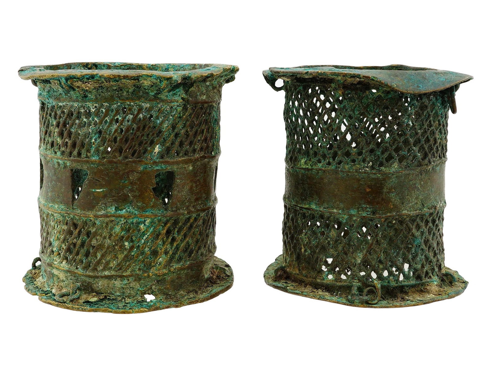 PAIR OF AFRICAN NIGERIA BENIN TRIBE IRON ARMLETS: A pair of African iron cylindrical armlets from the Benin Tribe of Nigeria. They display intricate lattice work and openwork design. Bears a green patina. Collectible Antique African Bronze Art.