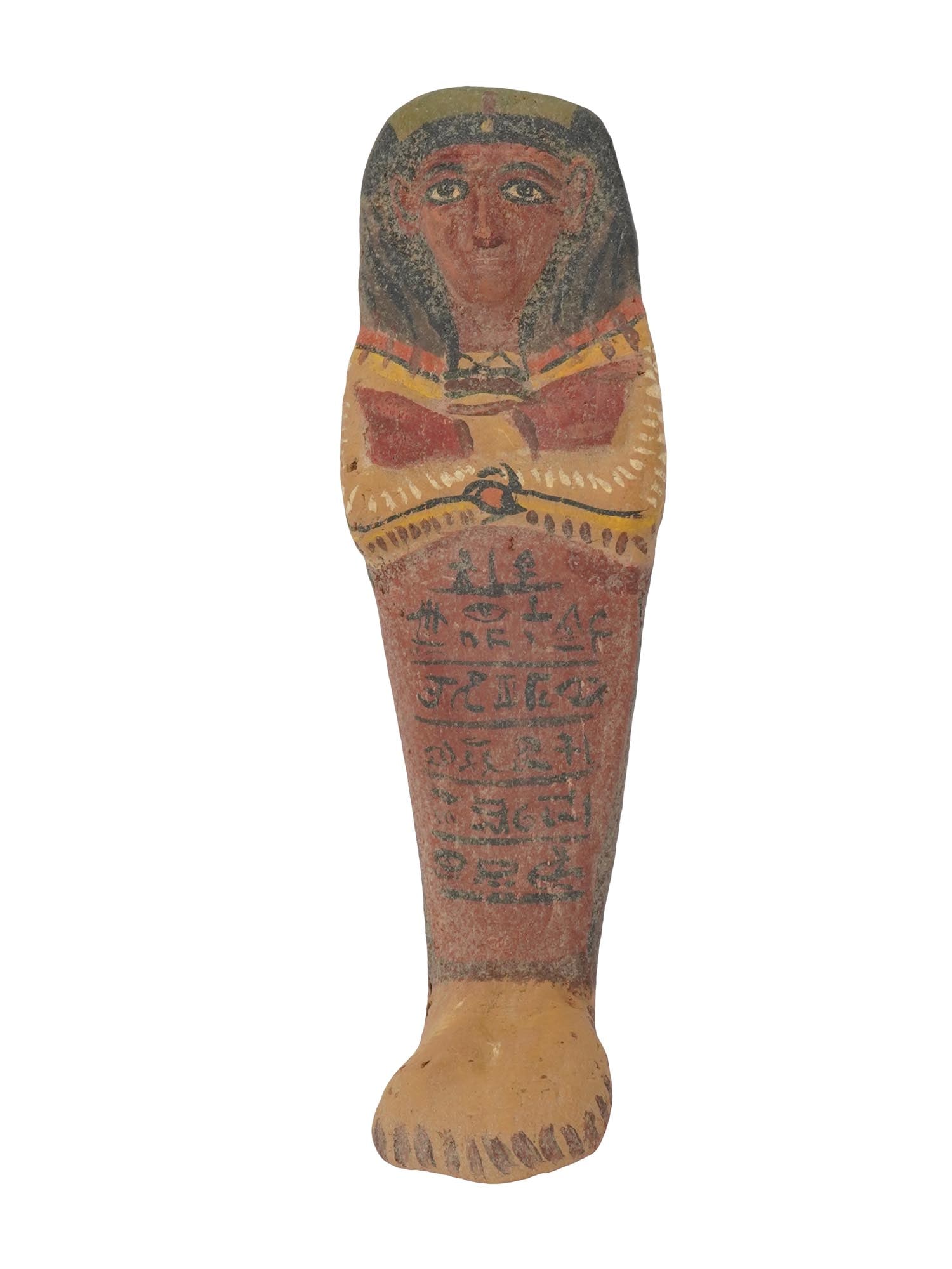 ANCIENT EGYPTIAN TERRACOTTA USHABTI CA 1570 TO 1342 BC: An ancient Egyptian 18th dynasty hand painted terracotta ushabti burial figurine, circa 1570 to 1342 BC. A column of black painted hieroglyphic symbols is presented atop the legs. The ushabti also cal