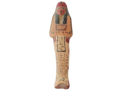 ANCIENT EGYPTIAN PAINTED CLAY USHABTI FIGURINE: An Ancient Egyptian clay ushabti figurine. New Kingdom period, ca. 1570 to 1340 BC. The piece is hand-painted with hieroglyphs. The ushabti or shabti is a type of funerary figurine used in ancient Egy