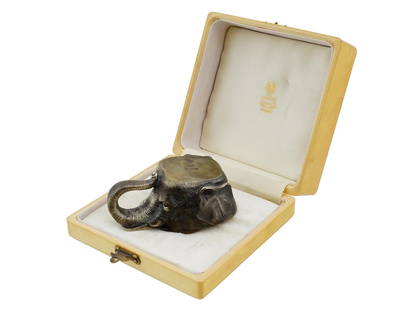 RUSSIAN 88 SILVER ELEPHANT HEAD VODKA CUP IOB: A Russian 88 Silver figural vodka cup modeled as an elephant head with finely detailed engraved details and skin texture. Hallmarked with the 88 Russian silver standard and a makers mark. A gold-washe