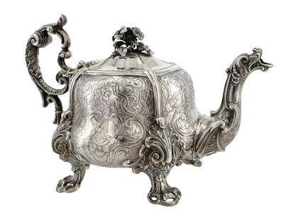 ANTIQUE FRENCH SILVER DRAGON TEAPOT BY ODIOT: An antique French silver teapot by Maison Odiot, a Parisian silversmith established in 1690 during the reign of Louis XV. The item is footed and has a figurative handle, the spout is dragon-shaped. Th