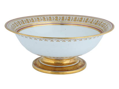 RUSSIAN IMPERIAL PORCELAIN BABIGON FOOTED BOWL: An antique Russian porcelain fruit bowl from the Babigon service by the Imperial Porcelain Manufactory, Saint Petersburg. Period of Nicholas I, 1825 to 1855. White piece with borders of gilt ivy withi