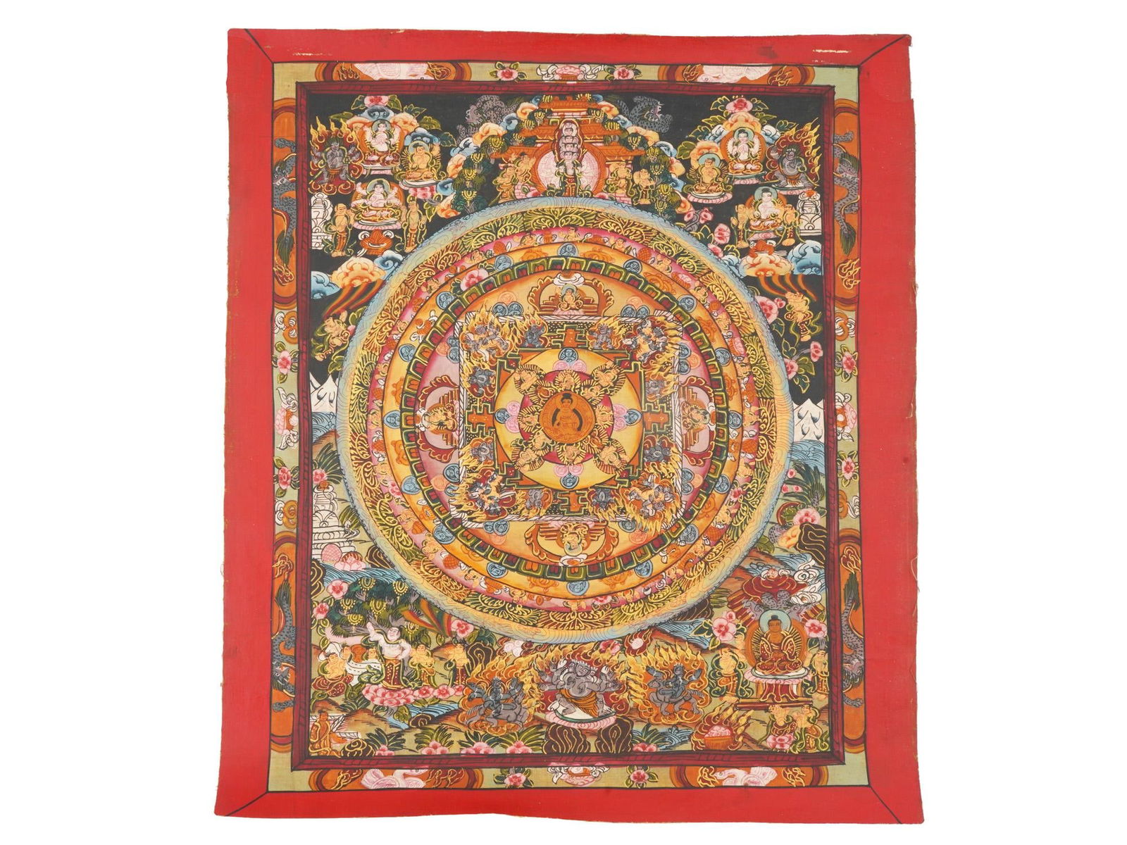 TIBETAN BUDDHIST THANGKA MANDALA PAINTING ON FABRIC: A Tibetan Buddhist Thangka polychrome painting on cotton. The thangka features a mandala, a symmetrical design in the tantric yoga of Buddhism and Hinduism, generally symbolizing the world, the univer