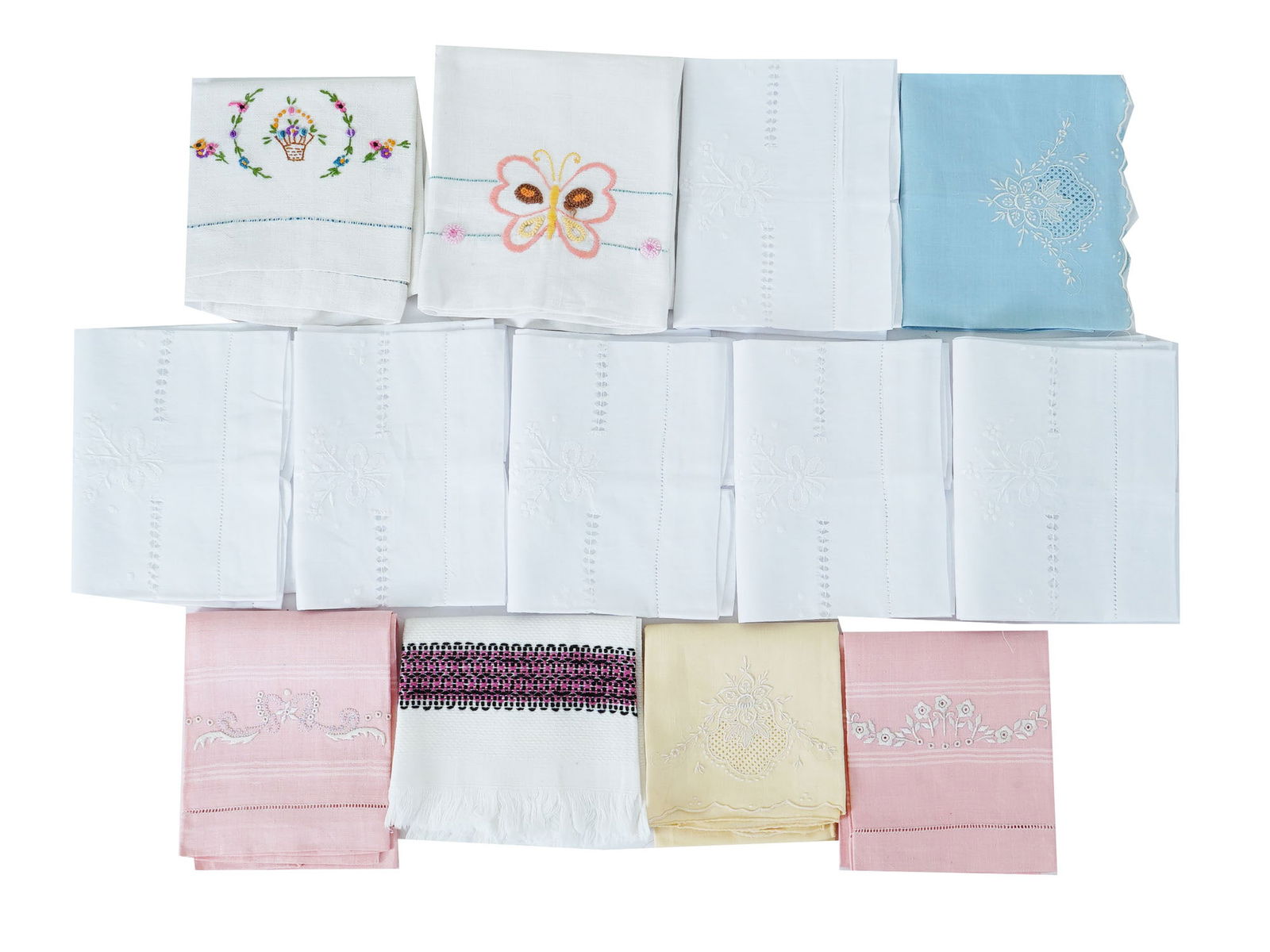 LOT OF VINTAGE EMBROIDERED LINEN GUEST HAND TOWELS: A lot of assorted vintage linen guest hand towels. The lot includes a variety of hand towels, predominantly in soft pastel hues such as pink, blue, and white. Each towel is adorned with detailed embro
