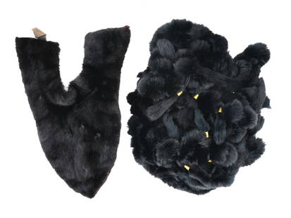 LOT OF TWO BLACK MINK FUR SHAWL WRAPS: A lot of two black mink fur neck shawl wraps. The first shawl has a minimalist style and a triangular shape. It has a Velcro fastener for fastening. The second depicts a different type of black fur sh