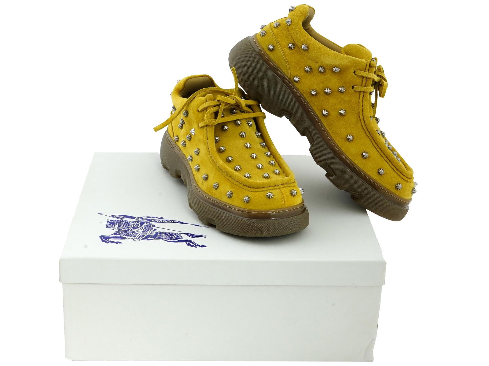 VINTAGE BURBERRY STUDDED SUEDE CREEPER SHOES IOB: A pair of vintage mens yellow suede oxford shoes by Burberry. European size 42. Silvertone studs allover. Flat heel. Round moc toe. Lace-up vamp with Equestrian Knight tag. Rubber sole with logo lette
