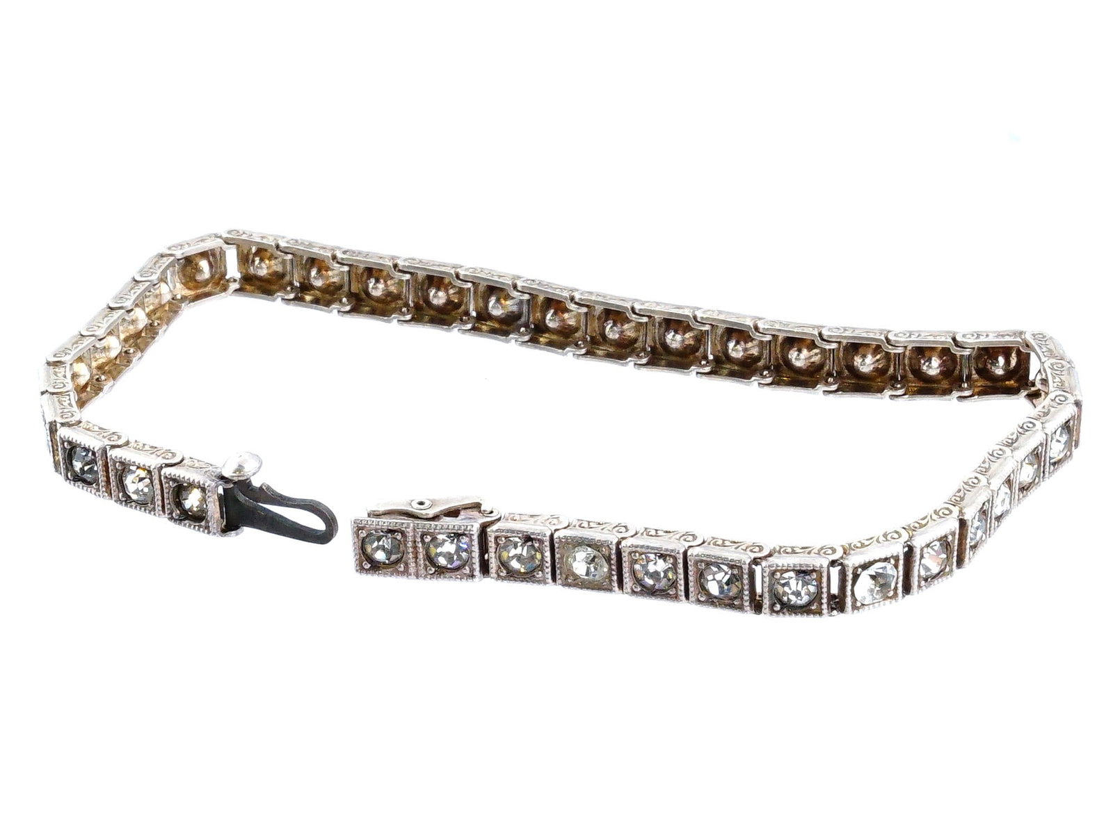 VINTAGE TENNIS DESIGN COSTUME JEWELRY BRACELET: A vintage tennis jewelry bracelet. The bracelet is encrusted with faux diamonds. Vintage and Mid century Ladies Jewelry Wares and Accessories For Collectors. THIS LOT QUALIFIES FOR A 30-DAY UNC