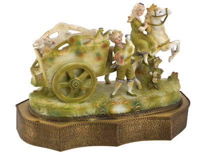 ANTIQUE FRENCH PORCELAIN AND BRASS TABLE LAMP: An antique early 20th century French porcelain table lamp with modern electrical fittings. Brass base. The body represents a sculptural group, a boy and girl on a horse-driven wagon with a dog and chi