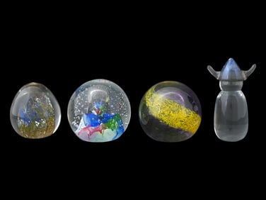 FOUR VINTAGE GLASS PAPERWEIGHTS OF VARIOUS DESIGNS