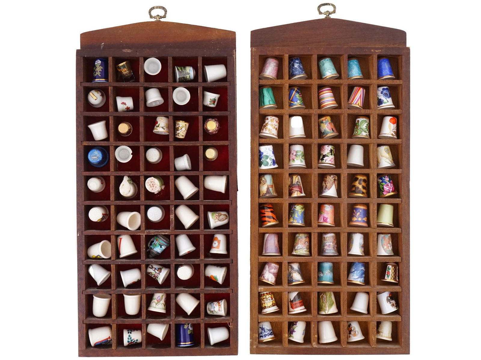 COLLECTION OF ENGLISH BONE CHINA THIMBLES W CASES: A large collection of English Bone China thimbles in two wooden cases. Each case contains 50 thimbles, 100 items total. Each thimble is a different design and made by different manufacturers, includin