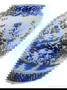 CHINESE QING BLUE AND WHITE PORCELAIN GINGER JAR: A large antique Chinese porcelain ginger jar. Qing dynasty, 19th century. White body with hand-painted cobalt blue flower, bird, and butterfly motifs. Ornamented rim and base. Unmarked. The lid is mis