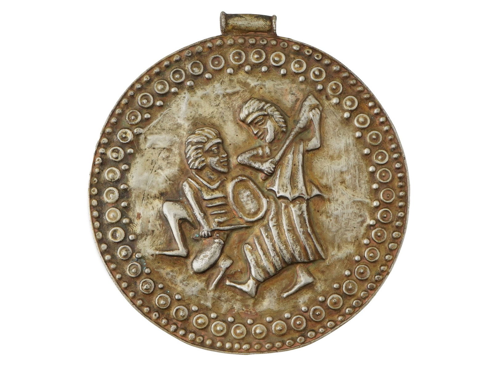 ANCIENT ROMAN JEWELRY METAL MEDALLION WITH TWO FIGURES: An ancient Roman metal medallion, featuring two chiseled figures centrally depicted within a finely detailed beaded frame. Likely a decorative or commemorative piece, this medallion exemplifies the ar