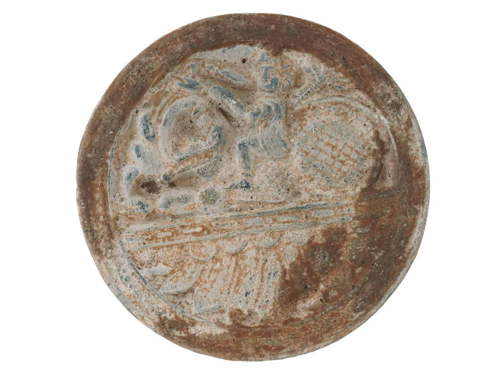 ANCIENT CENTRAL ASIAN BACTRIAN CIRCULAR CARVED IDOL: An ancient Central Asian carved idol. The idol has a circular shape and adorned with an engraved design representing a scene with a figure surrounded by ornaments. Ancient Central Asian Idols, Amulets