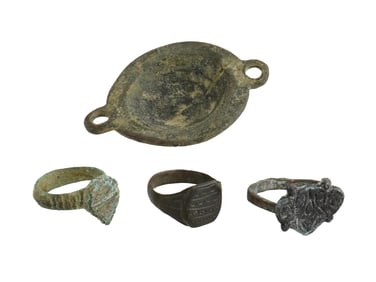 GROUP OF FOUR ANCIENT METAL RINGS AND A DISH
