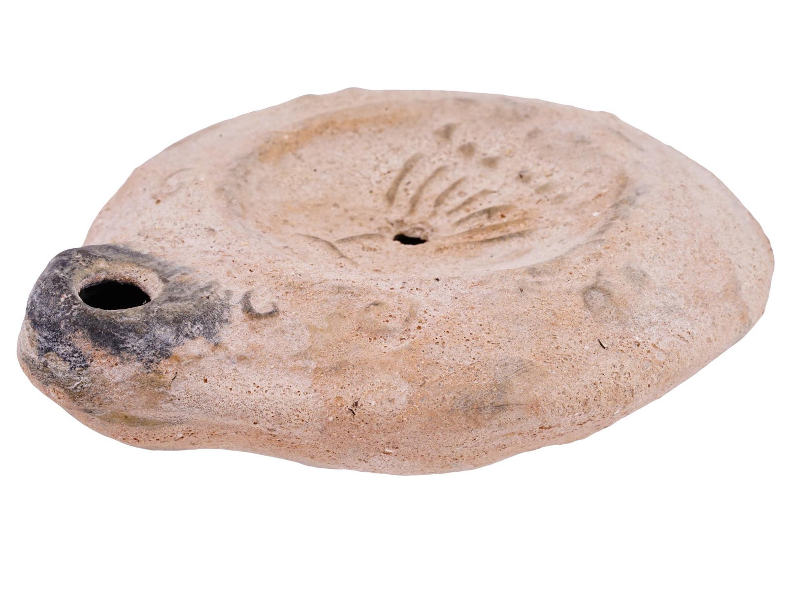 ANCIENT ROMAN JUDAICA OIL LAMP WITH MENORAH IMAGE: An ancient Roman Judaica oil lamp, featuring a depiction of a menorah prominently in the center. This artifact, originating from the Levant region during the Roman period, serves as a testament to the