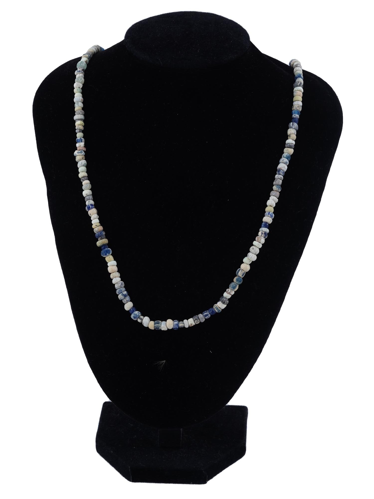 ANCIENT ROMAN MULTICOLOR GLASS BEADED NECKLACE: An ancient Roman multicolor glass beaded necklace. Each bead, meticulously crafted, reflects the artistry and sophistication of Roman craftsmanship. The kaleidoscope of colors captures the essence of