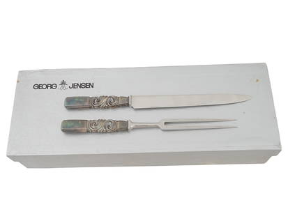 GEORG JENSEN DENMARK STERLING SILVER MEAT CARVING SET: A vintage meat carving set by Georg Jensen, a Danish jewelry and tableware company. Knife and meat fork, stainless steel blades and sterling silver handles with relief swirl motif. Hallmarks Georg Jen