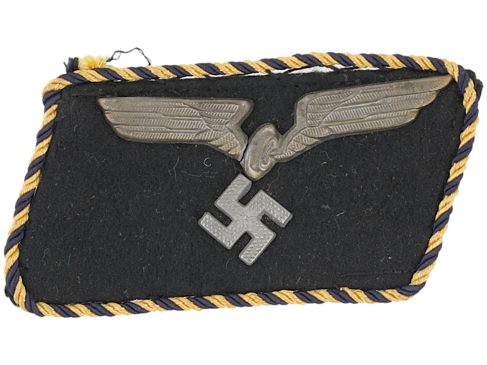 WWII TYPE GERMAN RBD RAILROAD OFFICIALS COLLAR TAB: A WWII type Nazi German RBD Reichsbahn Railroad Officials collar tab. Black wool construction collar tab with stamped metal alloy winged wheel, positioned above a canted, pebble finished swastika. Com