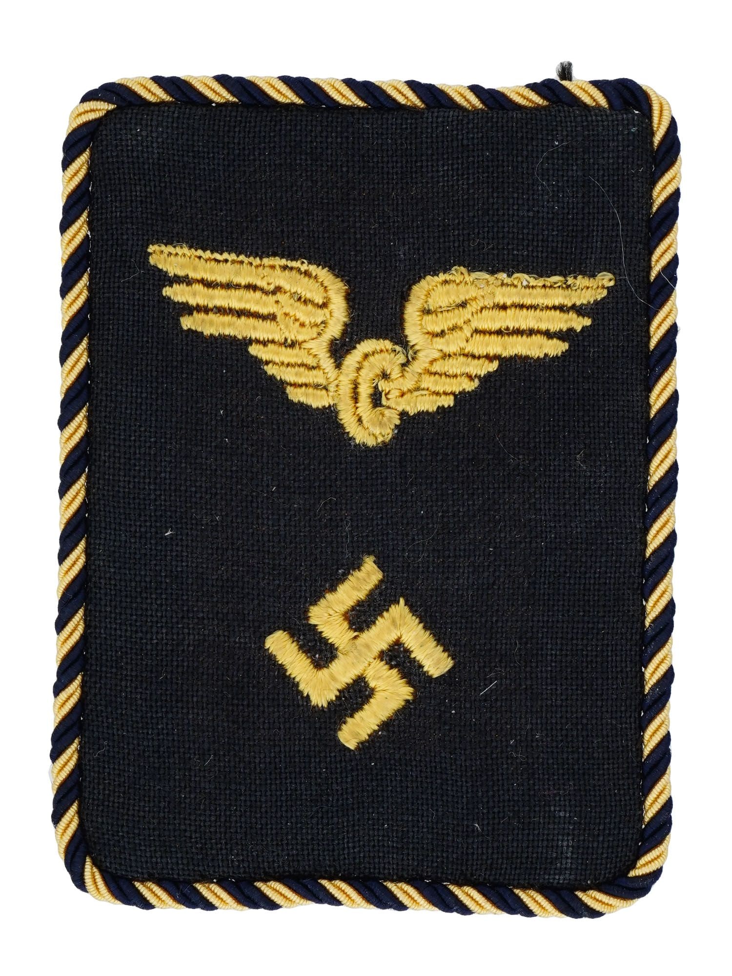 WWII TYPE GERMAN RBD RAILROAD OFFICIALS SHOULDER BOARD: A WWII type Nazi German RBD Reichsbahn Railroad Officials shoulder board. Black cotton construction collar tab with embroidered winged wheel, positioned above a canted, pebble finished swastika. Compl