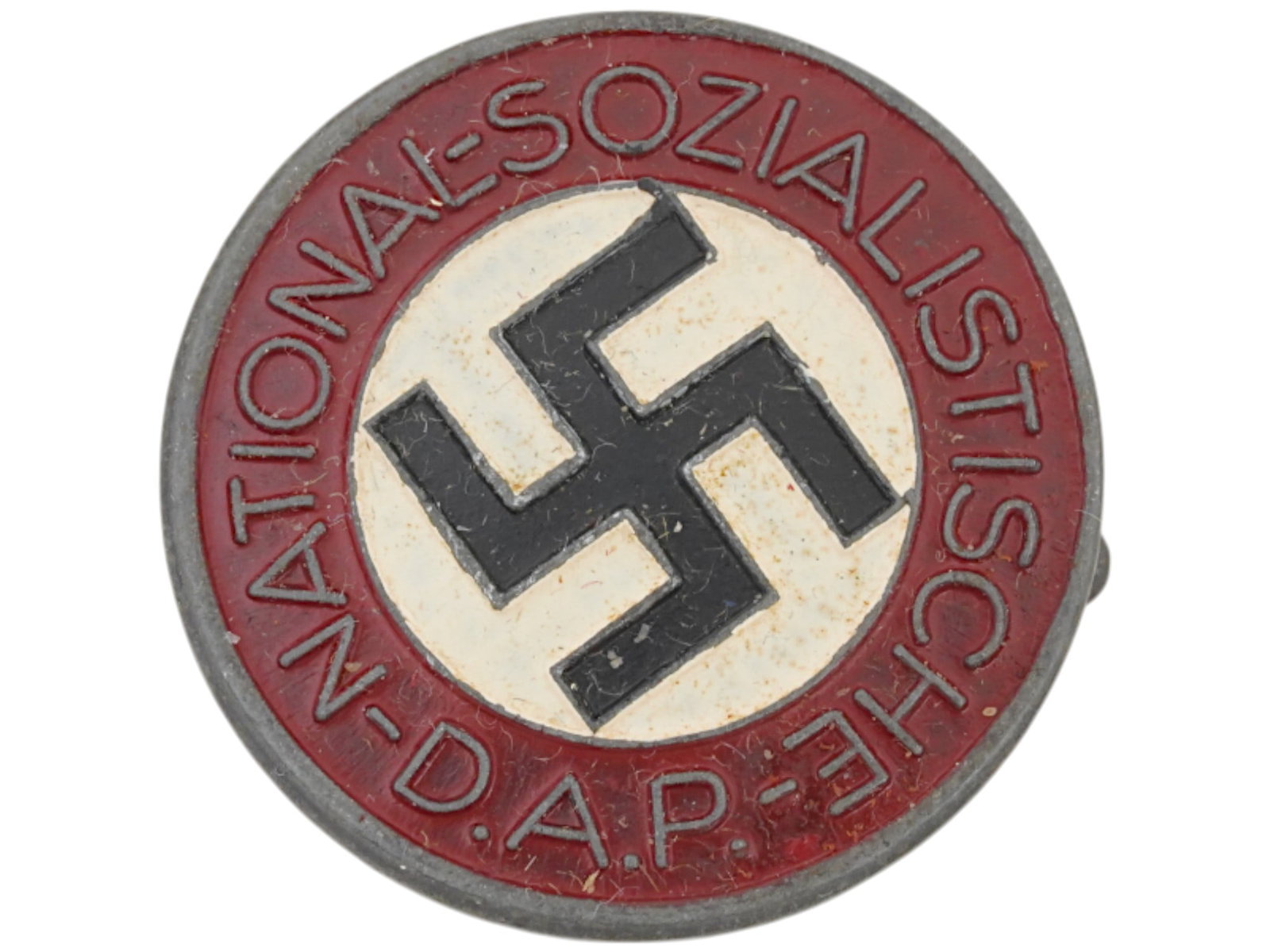 WWII GERMAN THIRD REICH NSDAP GOLDEN PARTY BADGE: A WWII Nazi German Third Reich political NSDAP party badge. The front reads, National Sozialistische D. A. P. The badge is enameled with a swastika insignia in the center. Has a thin horizontal safety