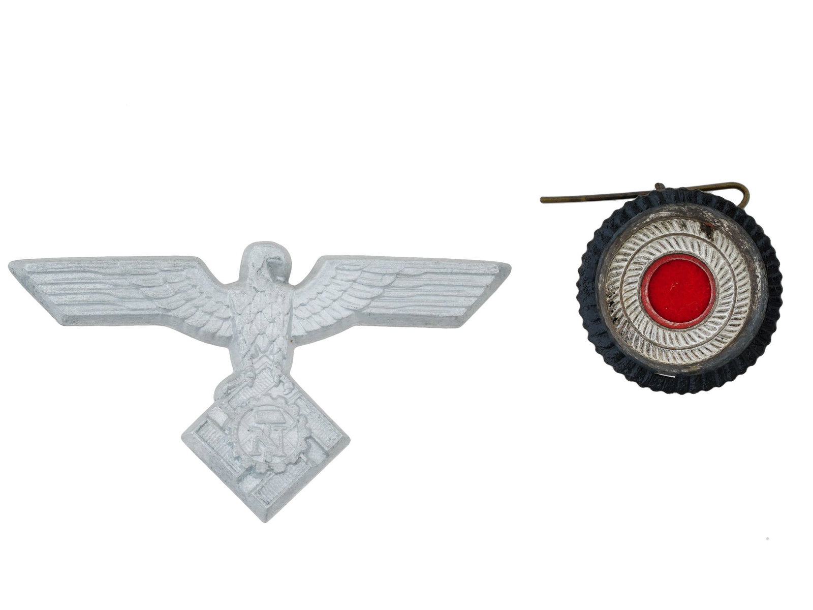 WWII NAZI GERMAN TENO VISOR CAP EAGLE WITH A COCKADE: A WWII Nazi German Third Reich TeNo Technische Nothilfe office visor cap eagle with a cockade. The metal eagle is depicted clutching a swastika, with outstretched wings, and is affixed above the natio