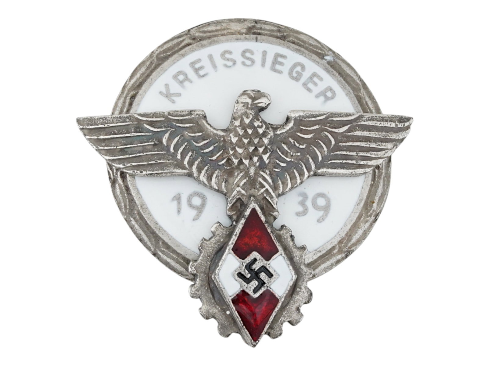WWII NAZI GERMAN HITLER JUGEND KREISSIEGER 1939 BADGE: A WWII Nazi German Hitler Jugend badge, Kreissieger 1939, awarded to district-level winners of the Hitler Youth performance competitions. The badge features a cogwheel encircling the red and white dia