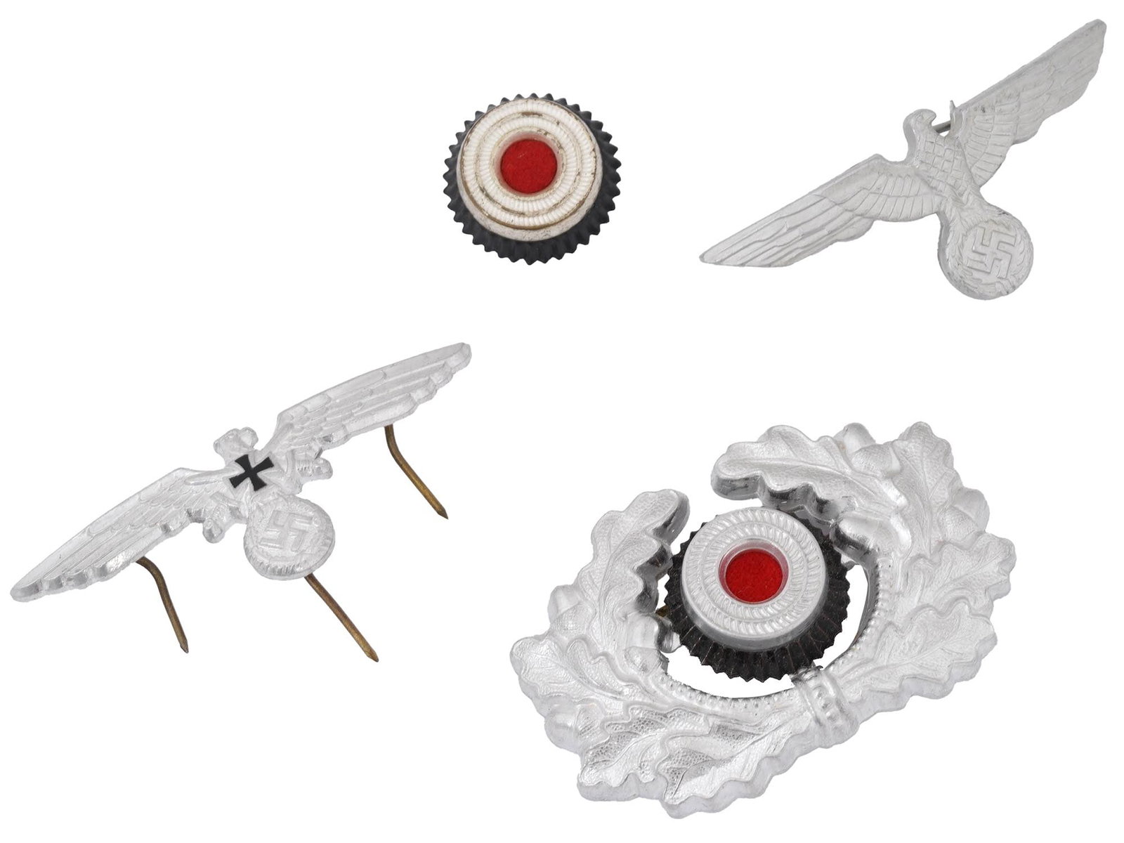 WWII NAZI GERMAN ARMY VISOR CAP COCKADE INSIGNIA SET: A WWII Nazi German Army insignia set, including a cockade, visor cap wreath, breast eagle, and cap eagle. These pieces were worn as part of the standard uniform and feature the traditional Wehrmacht d