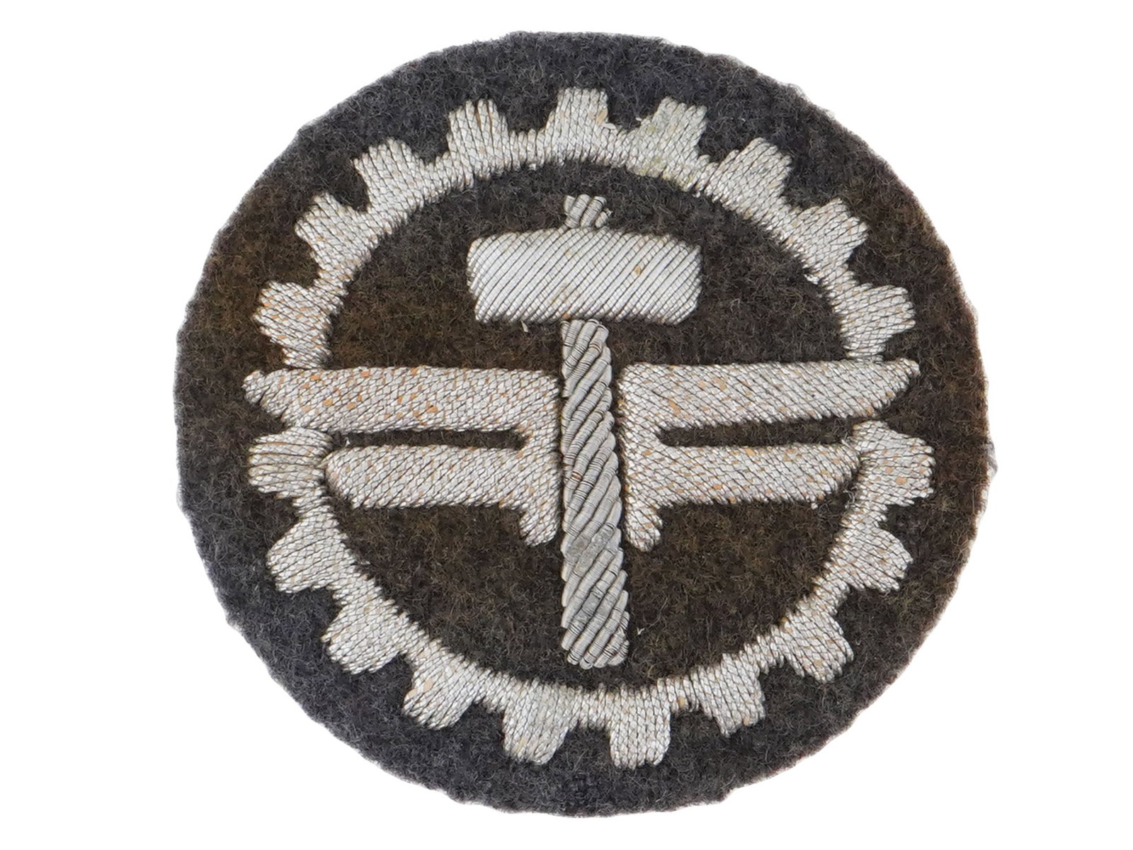 WWII NAZI GERMAN NSFK GLIDER WORKSHOP LEADER PATCH.: A WWII Nazi German NSFK sport and training glider workshop leader patch. The patch is constructed on a blue-grey circular wool base and features a detailed white embroidered design, a central cogwheel