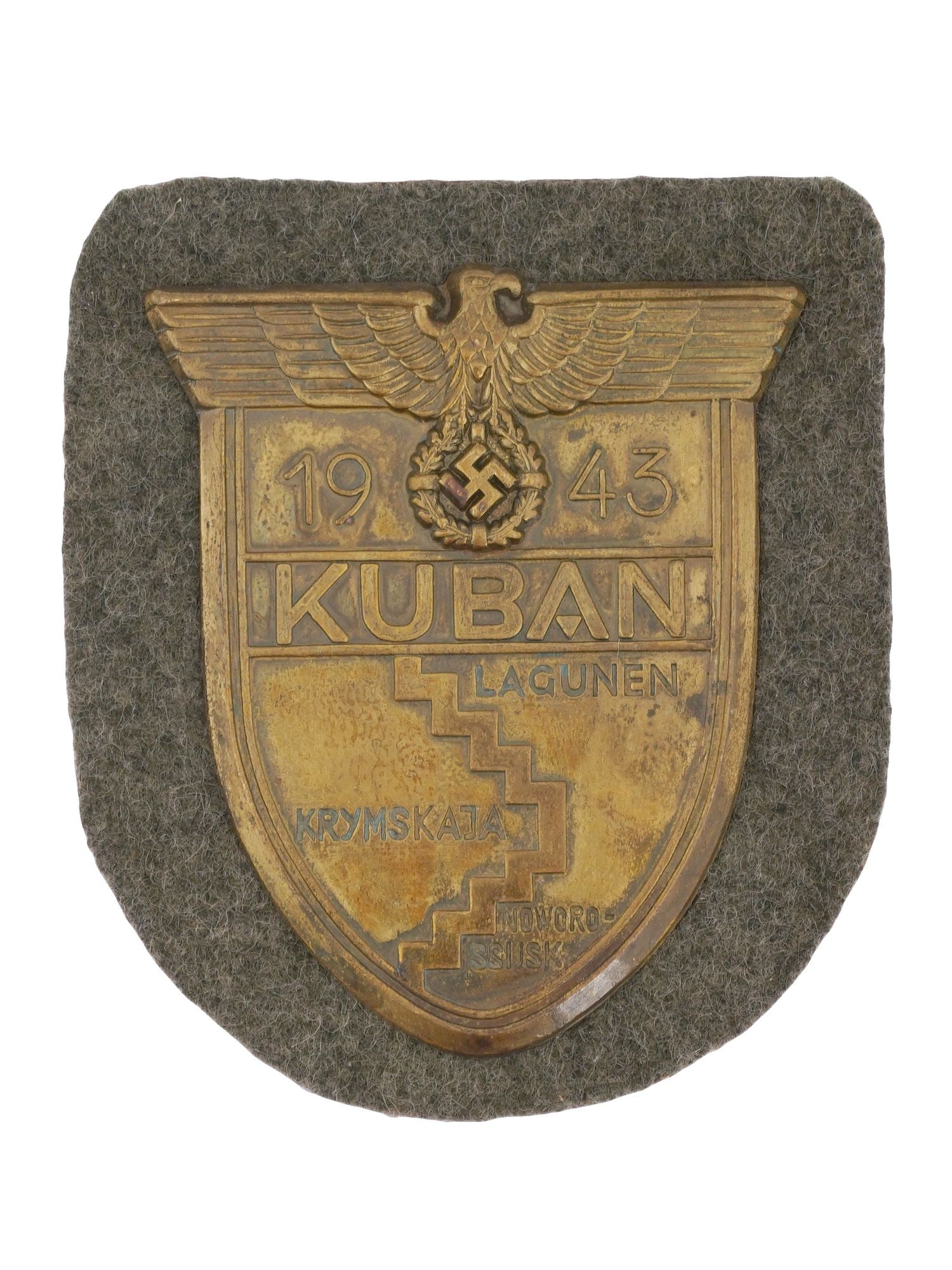 WWII NAZI GERMAN KUBAN SHIELD MILITARY BADGE: A WWII Nazi German Kuban shield, a military decoration awarded to Wehrmacht forces who defended the Kuban bridgehead in the Soviet Union from February to October 1943. The shield features a German eag