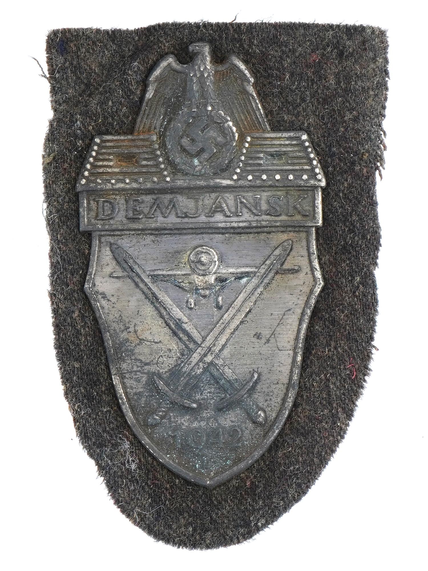 WWII GERMAN MILITARY DEMYANSK SHIELD DECORATION: A World War II German military Demyansk Shield decoration. The Demyansk Shield was awarded to Wehrmacht personnel who fought in the Demyansk pocket on the Eastern Front in the early months of 1942. Th