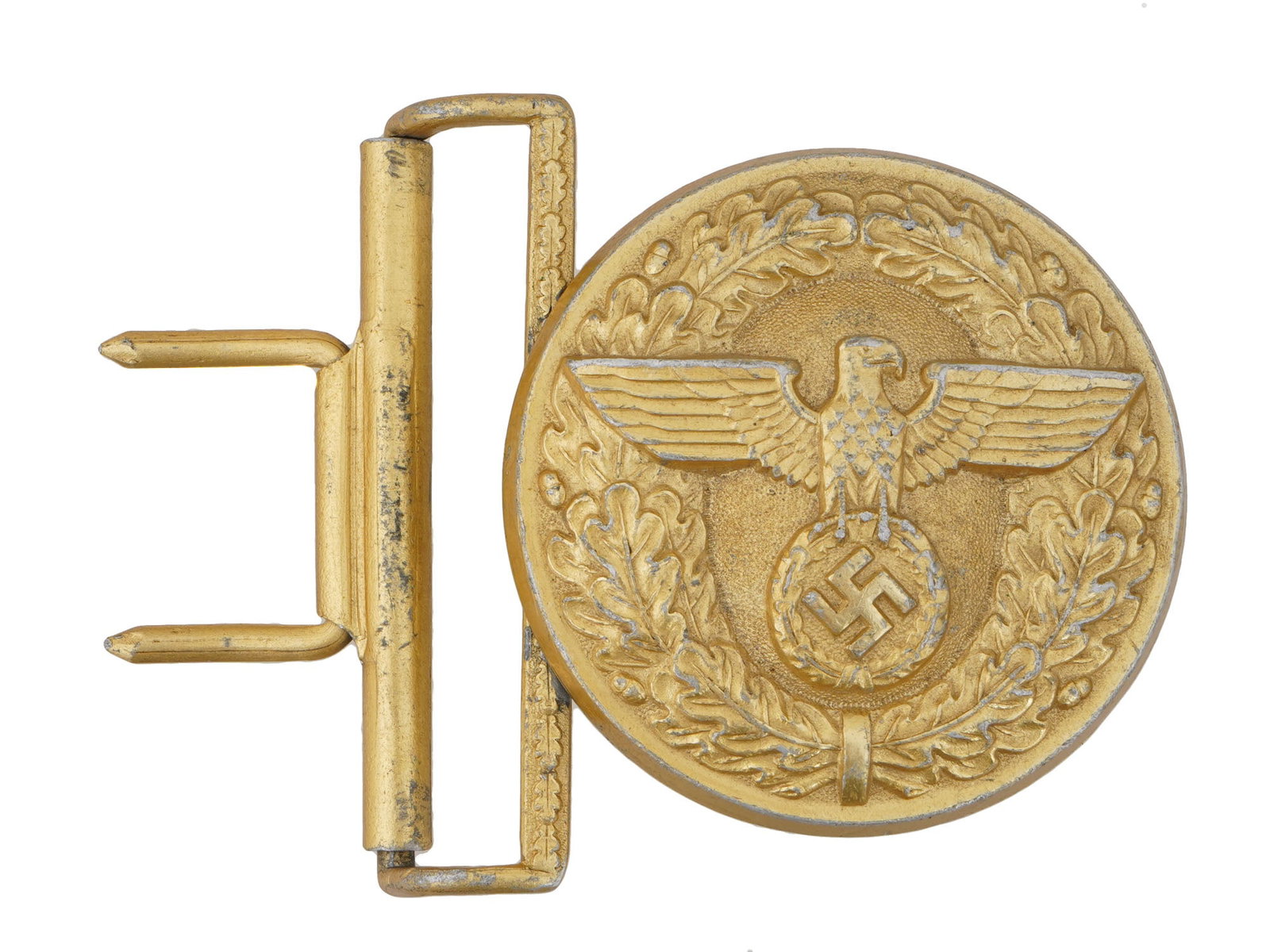 WWII TYPE GERMAN NSDAP OFFICIAL PARADE BELT BUCKLE: A WWII type NSDAP German Official Parade belt buckle. The front is embossed with a round oak leaf wreath, encompassing a slightly domed inner field with a German eagle with a swastika insignia to the 
